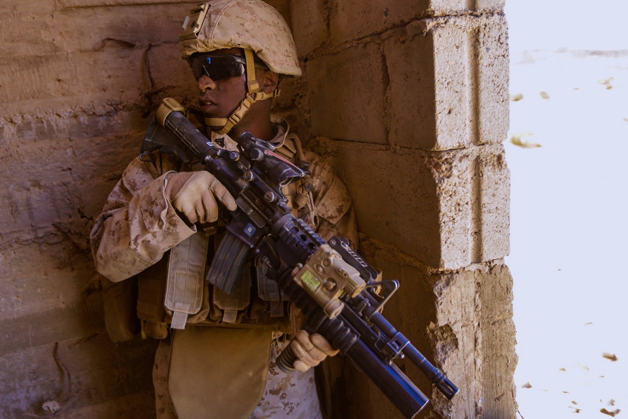 Marine providing security during a military operations in urban terrain exercise.