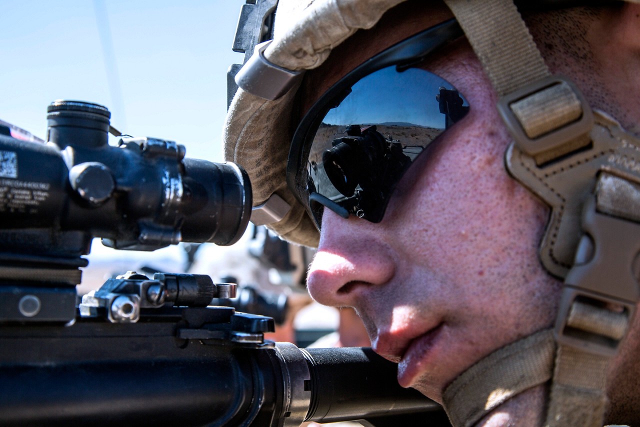 Marine looking through their rifle sight during training.