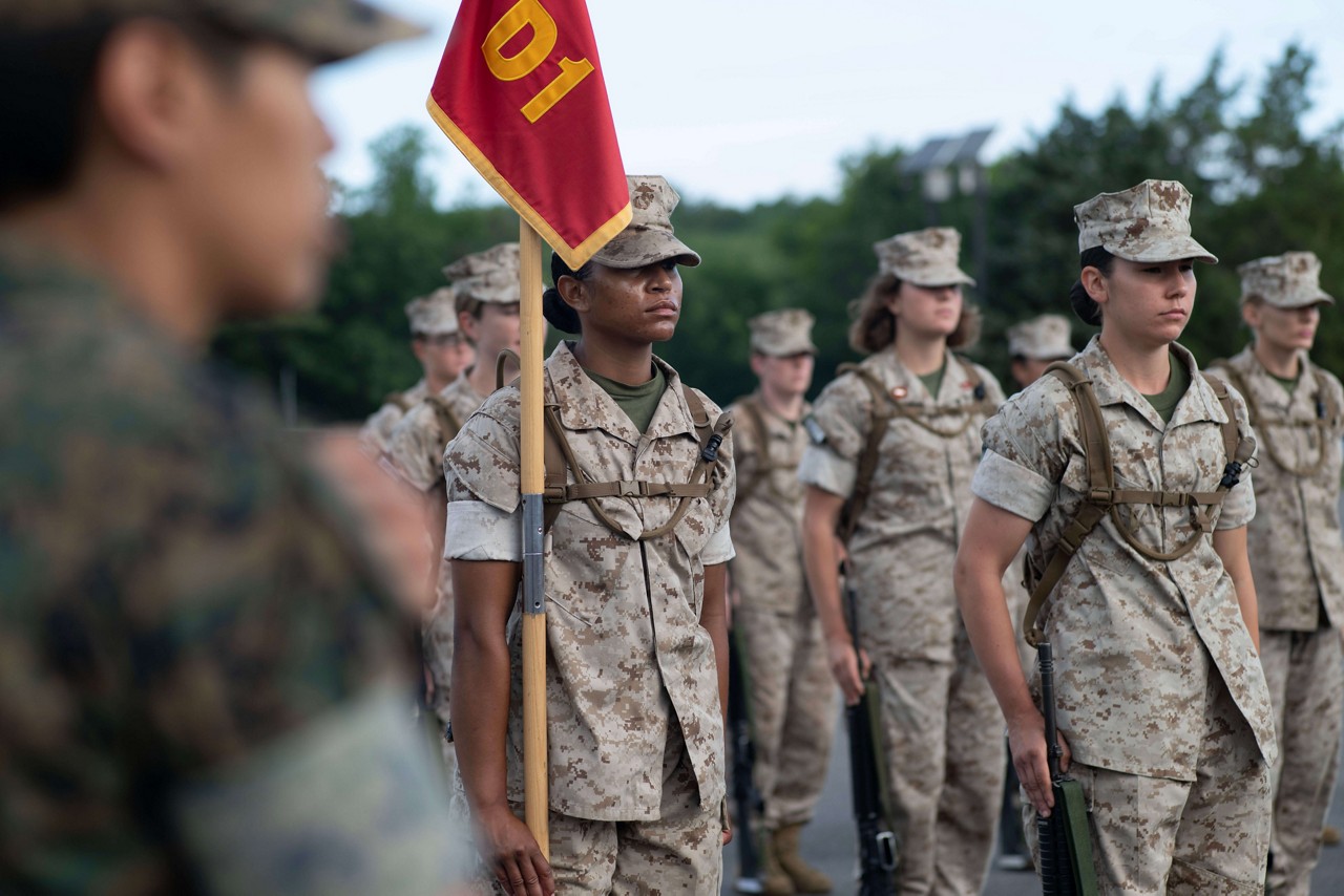  A platoon of Marine Corps Officer Candidates practice drill movements.  