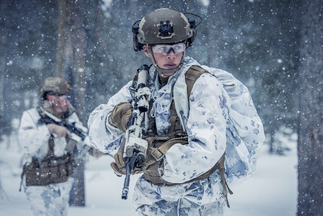  A U.S. Marine with a rifle wears snow camouflage. 