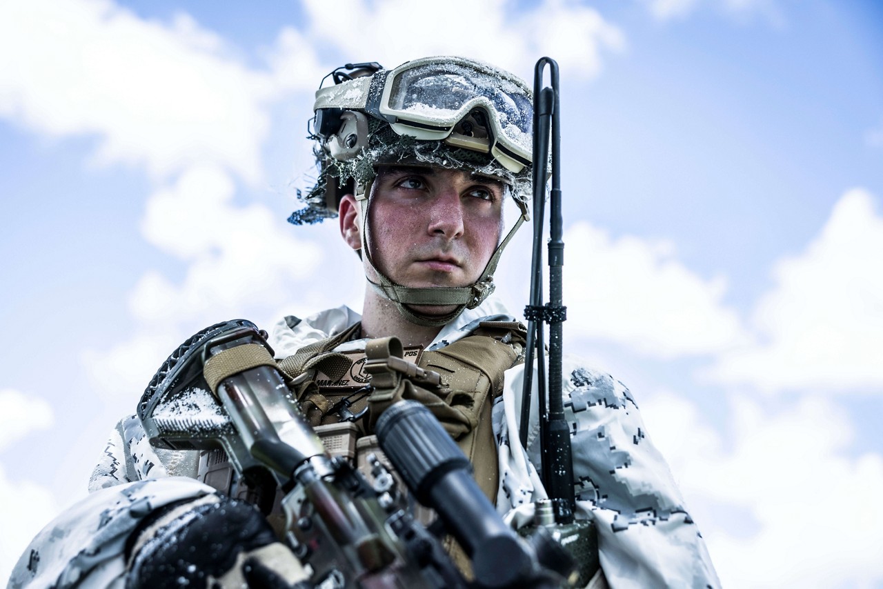  A U.S. Marine with a rifle wears snow camouflage. 
