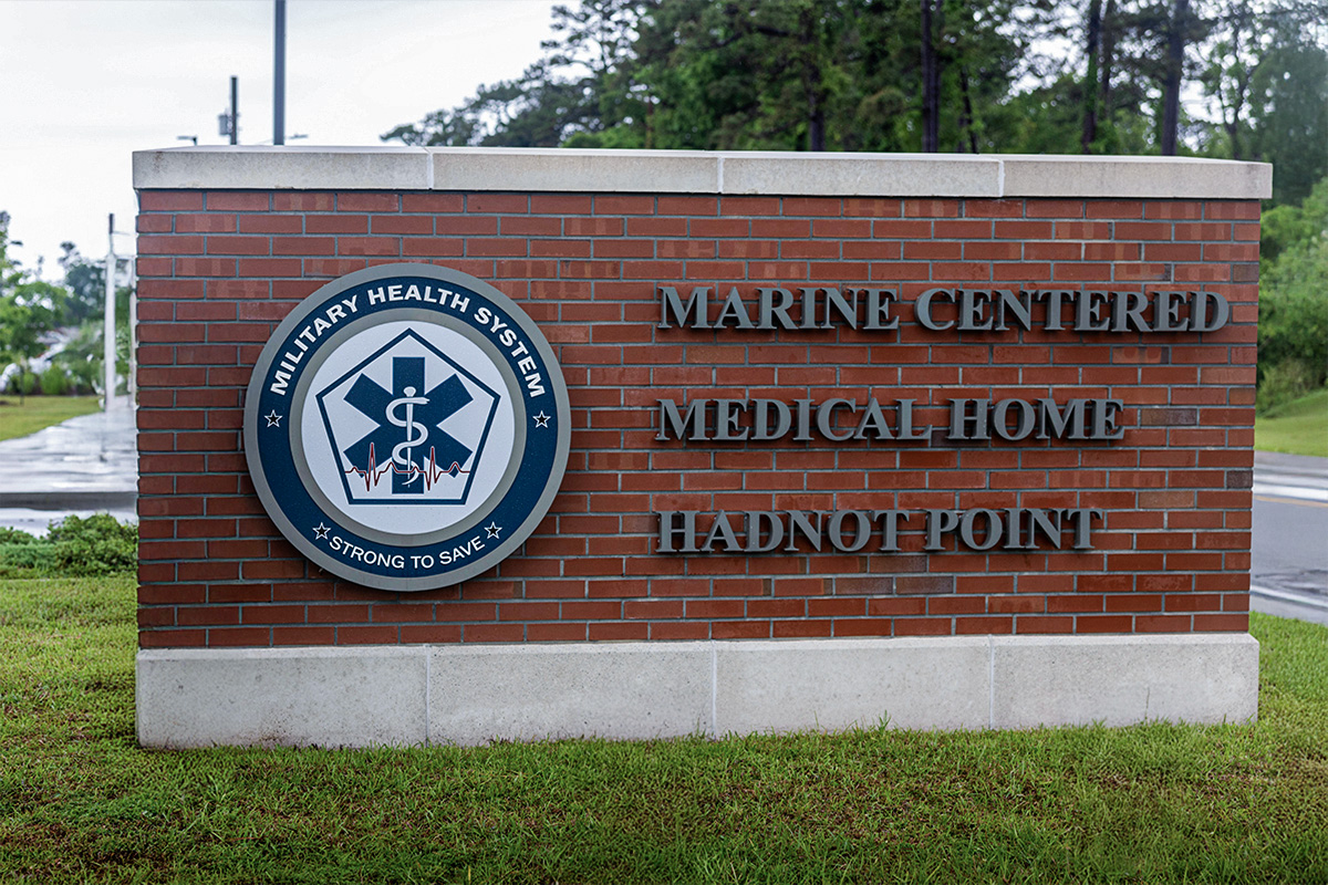 Military Health System Marine Centered Medical Home sign at Hadnot Point facility.