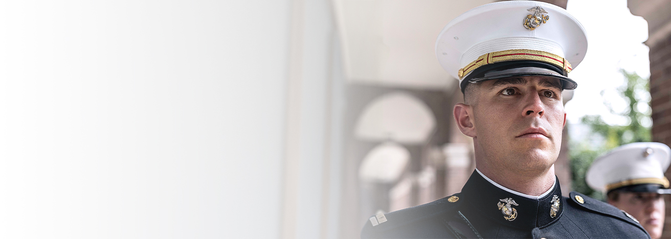 A Marine dress blue uniform with white cover at Marine Barracks Washington.