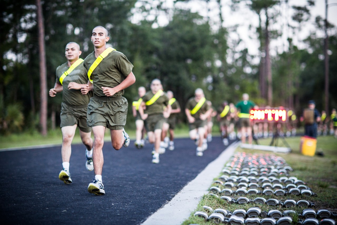 Aspiring Marine midway through doing a pull up.